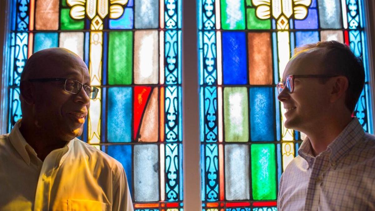 The Rev. James W. Goolsby Jr., left, senior pastor of First Baptist Church, and the Rev. Scott Dickison, right, senior pastor of First Baptist Church of Christ, meet at Dickison’s church in Macon, Ga. Dickison, who grew up in Charlotte’s Providence Baptist Church, and Goolsby are working to find a way the congregations, neighbors for so long, can become friends by bridging the stubborn divide of race.