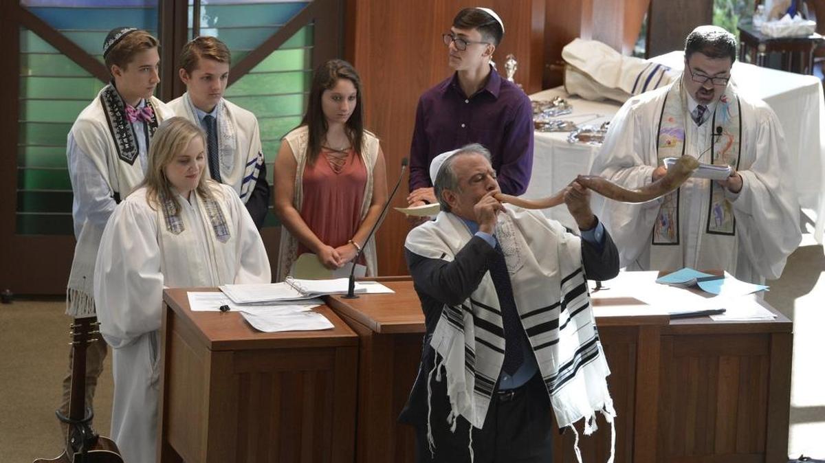 In the file photo Steve Katzenstein blows the shofar in celebration of Rosh Hashanah at Temple Beth El in Charlotte, N.C.