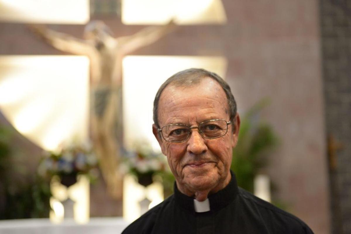 Monsignor John McSweeney, 75, is retiring this month after more than 40 years as a priest in the Catholic Diocese of Charlotte. Since 1999, he’s been pastor of St. Matthew Catholic Church (in background), which has grown to become the largest Catholic parish in the United States.