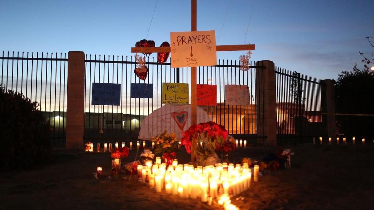 A memorial is seen near the Inland Regional Center in San Bernardino, Calif., as the community remembers those injured and killed during the shooting at the center this month. Police continue to investigate a mass shooting that left 14 people dead and another 17 injured