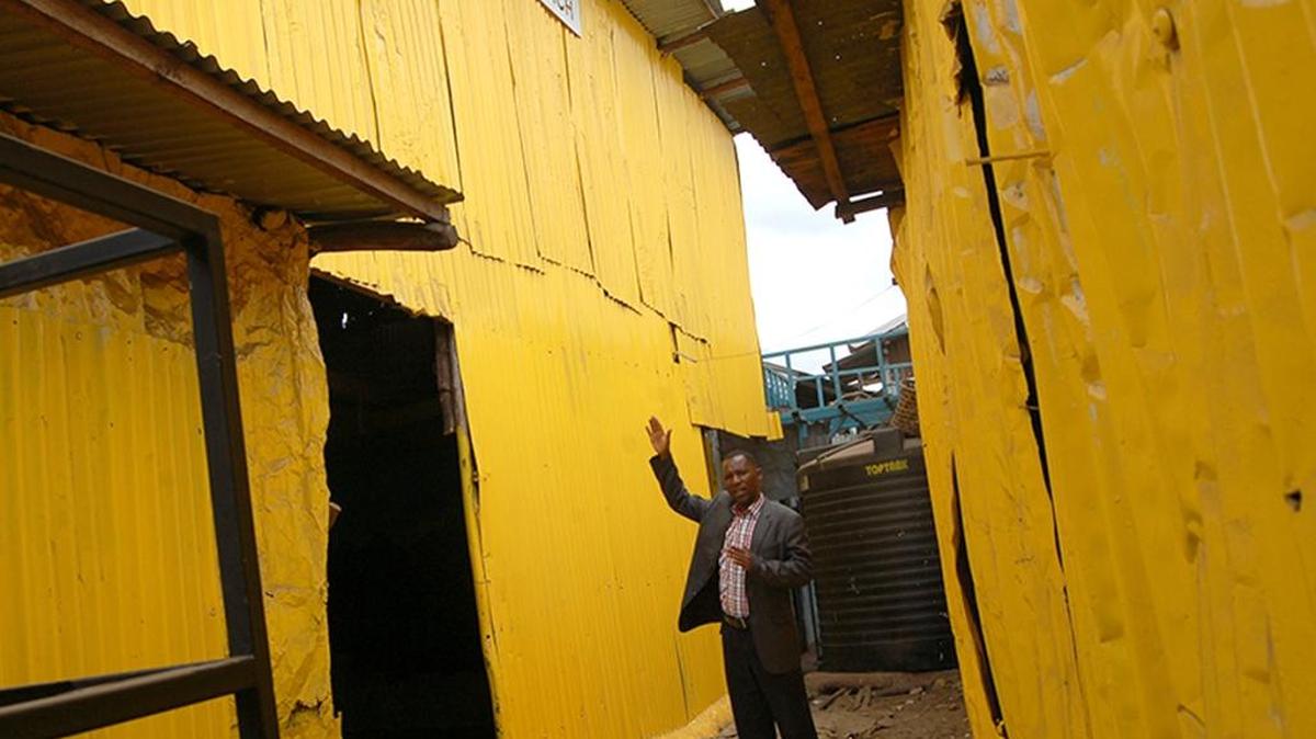 Pastor Steve Shirima, the leader of the Jesus is the Key to Life Ministries, a slum Pentecostal Church explains how his church was painted yellow.