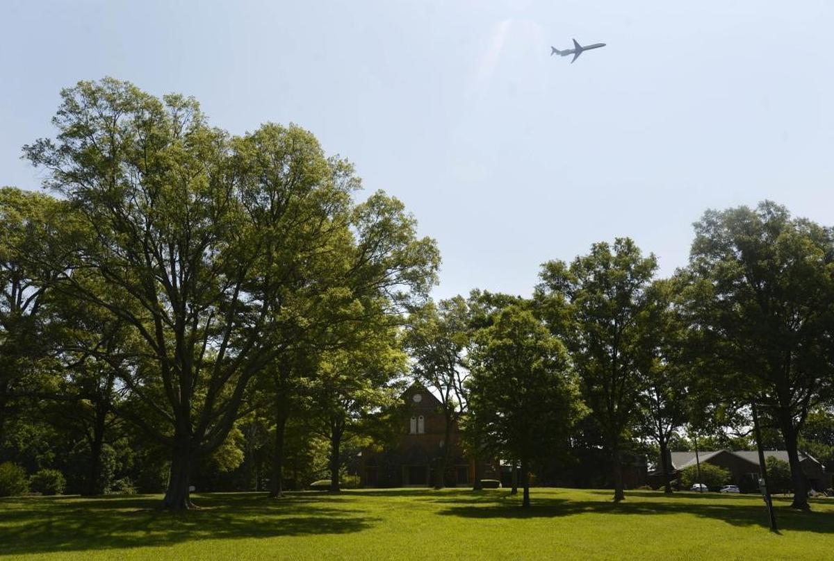 An airplane from nearby Charlotte Douglas International Airport flies over Steele Creek Presbyterian Church on Friday. The church, founded when North Carolina was still a British colony, is the second oldest house of worship in Mecklenburg County. But to stay alive, this 257-year-old church may soon have to decide to give up its land, maybe even its name. The thoroughly modern reason: Its close proximity to the ever-expanding airport, which has its eye on the property that’s been home to the church since Scots-Irish settlers had their first worship service there in 1760.