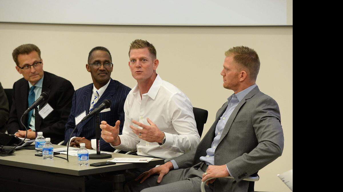 
From left: Mart Green, whose family owns Hobby Lobby; Bishop Claude Alexander, senior pastor of the Park Church; David Benham and brother Jason Benham, who sell real estate, talk about their Christianity at Gordon-Conwell Theological Seminary on Friday. The crowd of around 100 asked about how they incorporate their private beliefs into their jobs.
