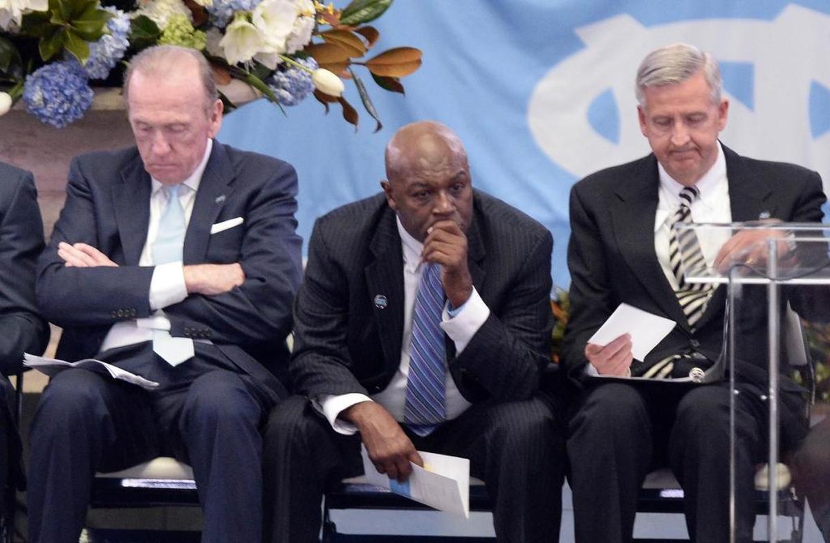 David Chadwick (right) spoke at the memorial service for his old North Carolina basketball coach, Dean Smith, in Chapel Hill in 2015. Former UNC players Billy Cunningham (left) and Phil Ford also attended the service.