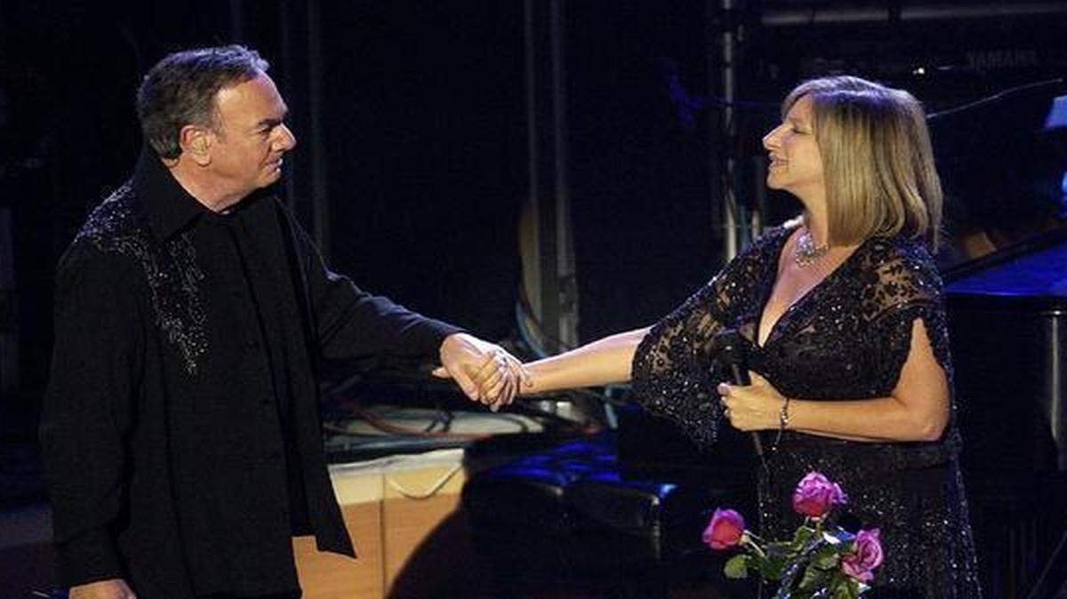 
Neil Diamond and Barbra Streisand reunite for a fundraiser at the Walt Disney Concert Hall in Los Angeles in 2004. They performed their 1978 hit, “You Don't Bring Me Flowers.” 
