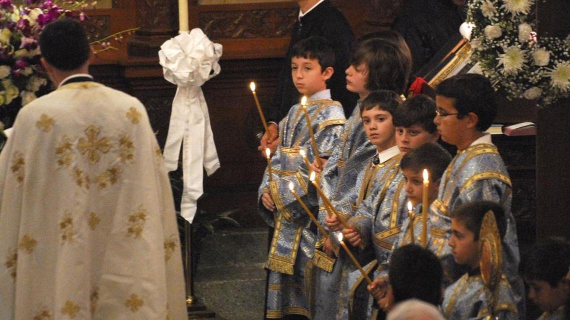 Alter boys and candles play a role during a service the weekend of Pascha in 2015 at Holy Trinity Greek Orthodox Church in Charlotte.