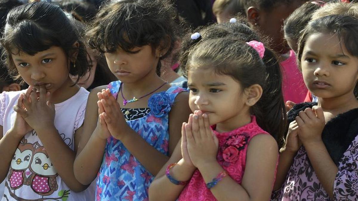 
Children and adults observe the 64th annual National Day of Prayer at a morning service at University City YMCA, Thursday May 07, 2015. Prayers were recited in English, Spanish and Telugu, a language popular in India.
