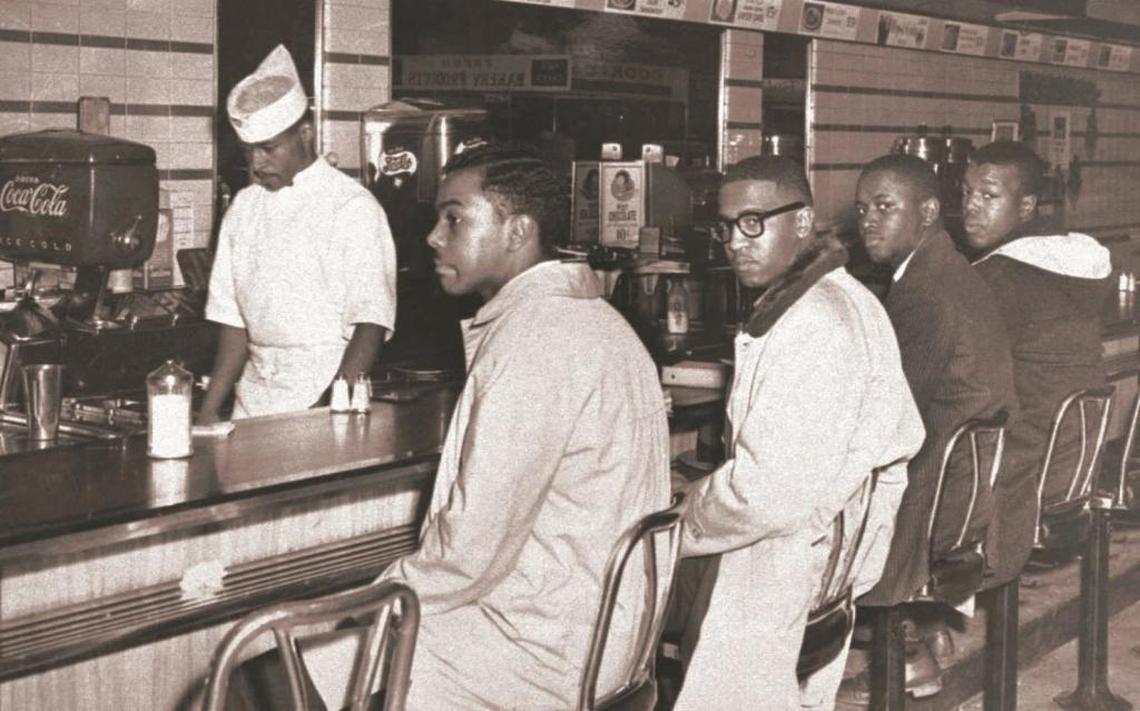 Clarence Henderson, far right, took part in the 1960 sit-in at a Woolworth’s lunch counter in Greensboro.