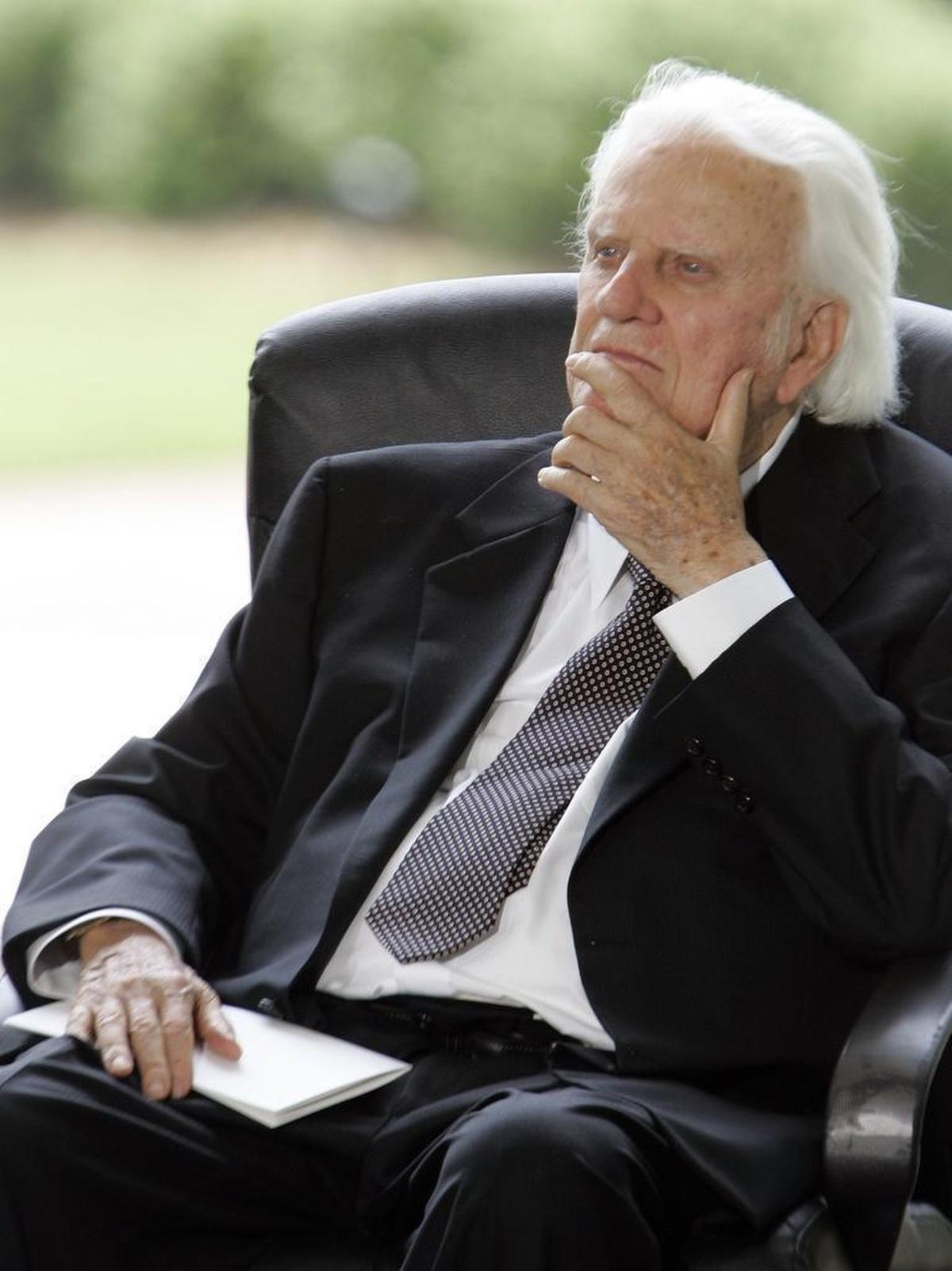In 2007, Billy Graham joined with three former U.S. presidents and a large crowd to dedicate the Billy Graham Library in Charlotte. Here, Graham listens to the parade of speakers at the event. Since its opening 10 years ago, the presidential-like library detailing Graham’s life has drawn more than 1 million visitors.