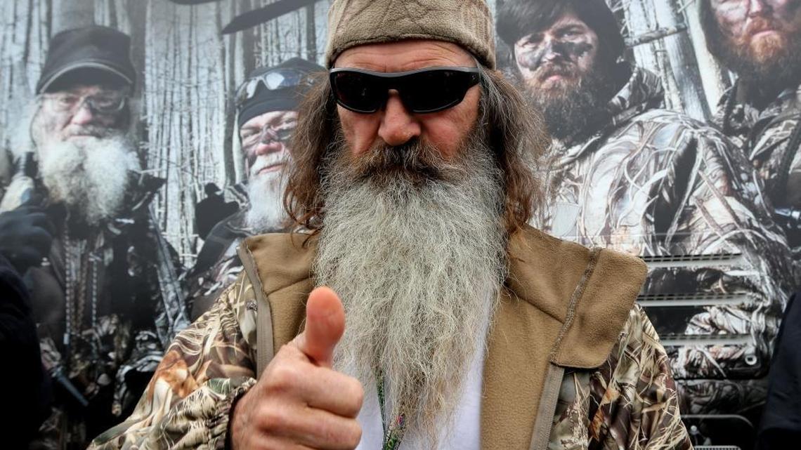 Reality TV personality Phil Robertson greets fans in the Duck Commander Compound at Texas Motor Speedway on April 5, 2014 in Fort Worth, Texas.