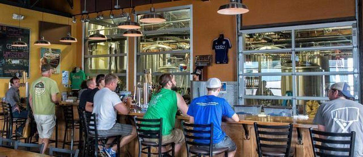 Breweries are flourishing in the NaDa area, per this scene at NoDa Brewing Company, 2229 N. Davidson St.