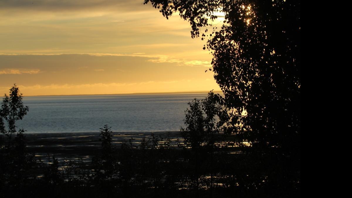 
Anchorage’s city limits are roughly the size of Delaware. In Anchorage at sunrise, you can gaze on Cook Inlet.

