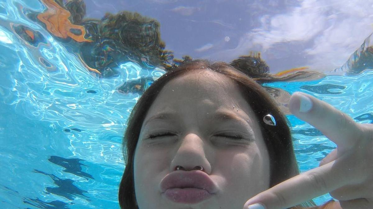
The Peninsula Club, Lake Norman
“Here is a ‘selfie’ of Gracie Redmond, an avid photographer and videographer. This photo was taken underwater while testing out her new Polaroid cub that she got for her birthday the day before, July 7!”
– Elise Redmond, Cornelius
