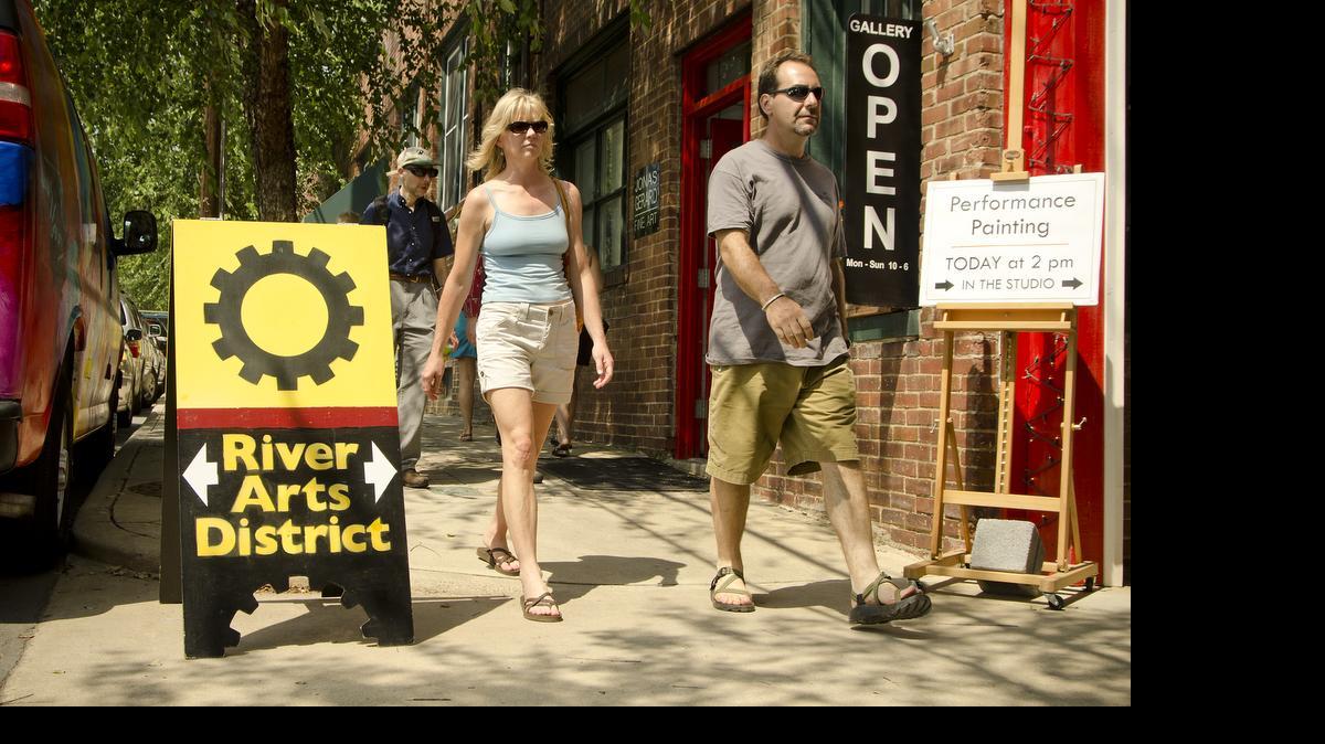
In the River Arts District, you’ll see artists at work, wander around beautiful old brick buildings, and shop. 

