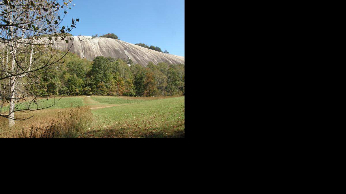 
 Stone Mountain State Park, covering nearly 14,000 acres, centers on a 600-foot granite dome.
