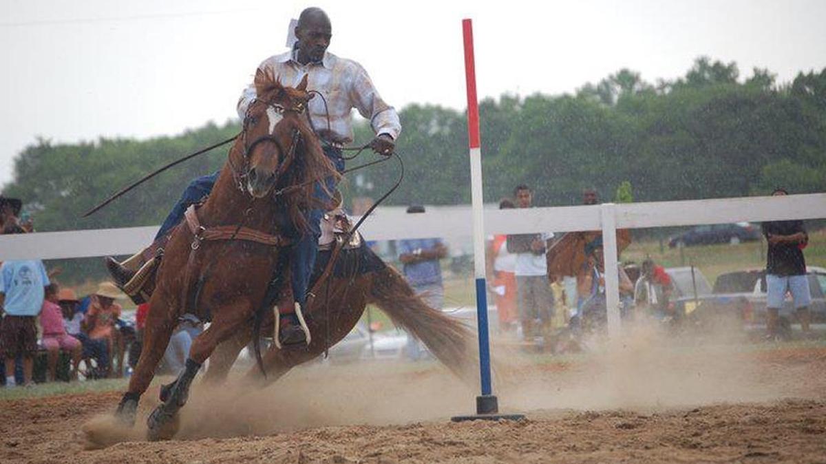 Michael Taylor of Smithfield, N.C. – he also goes by “Cowboy Mike” – is in a pole-bending event at the Black Cowboy Festival.