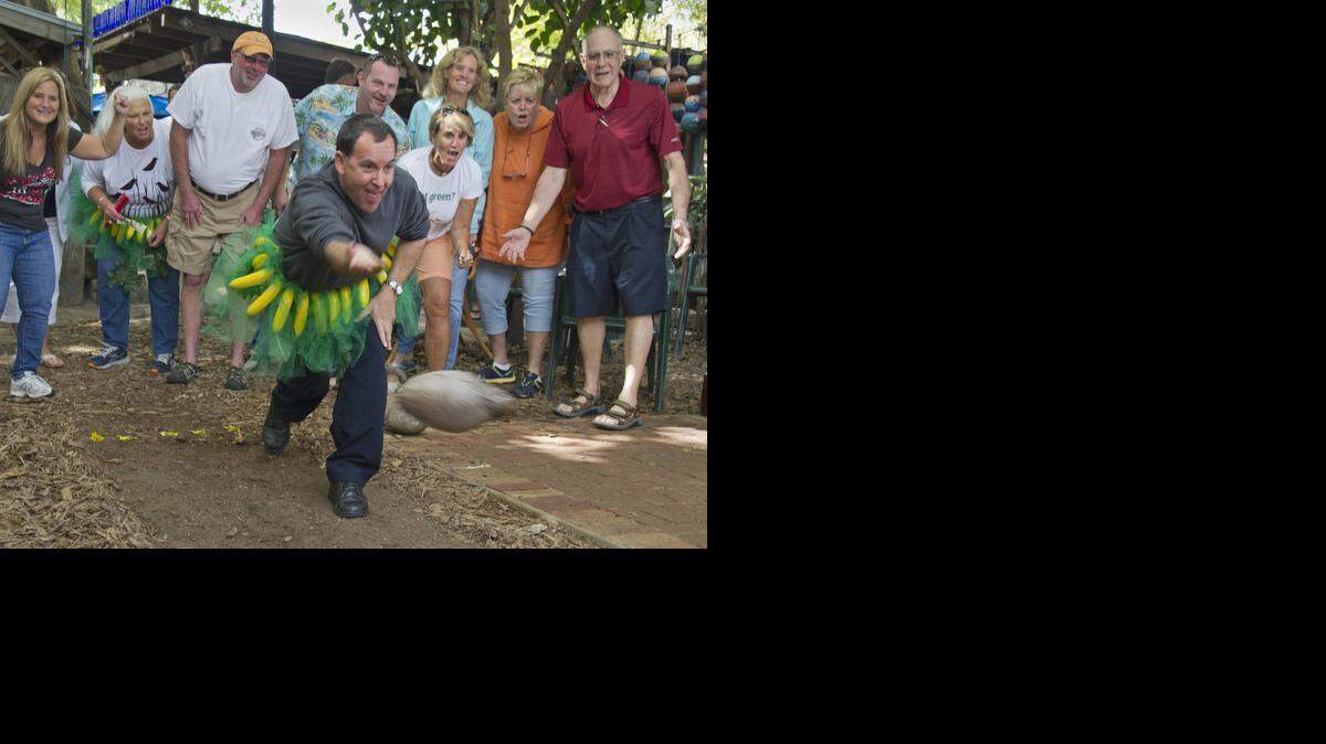 
A visitor takes part in Coconut Bowling at the Blue Heaven restaurant in Key West, Fla. The offbeat competition was an event of the Key West Food & Wine Festival. 
