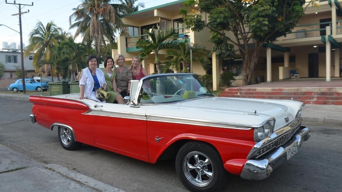 Vintage American cars are impossible for tourists to resist. Here, we get ready for a ride in a 1959 Ford Fairlane taxi in the resort town of Varadero.