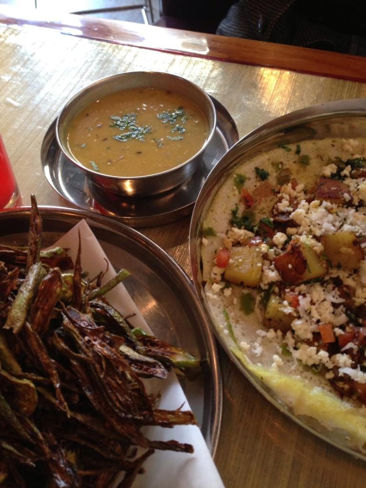 Chai Pani’s okra, sliced and fried crisp, then served with lime juice and salt, plus uttapam (a rice-lentil crepe) with potatoes and paneer.