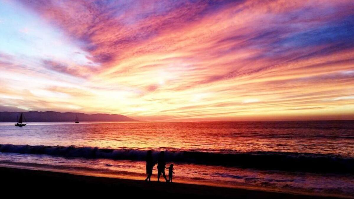 Waves of color over the Pacific as the sun sets on the beaches of Puerto Vallarta, Mexico.
