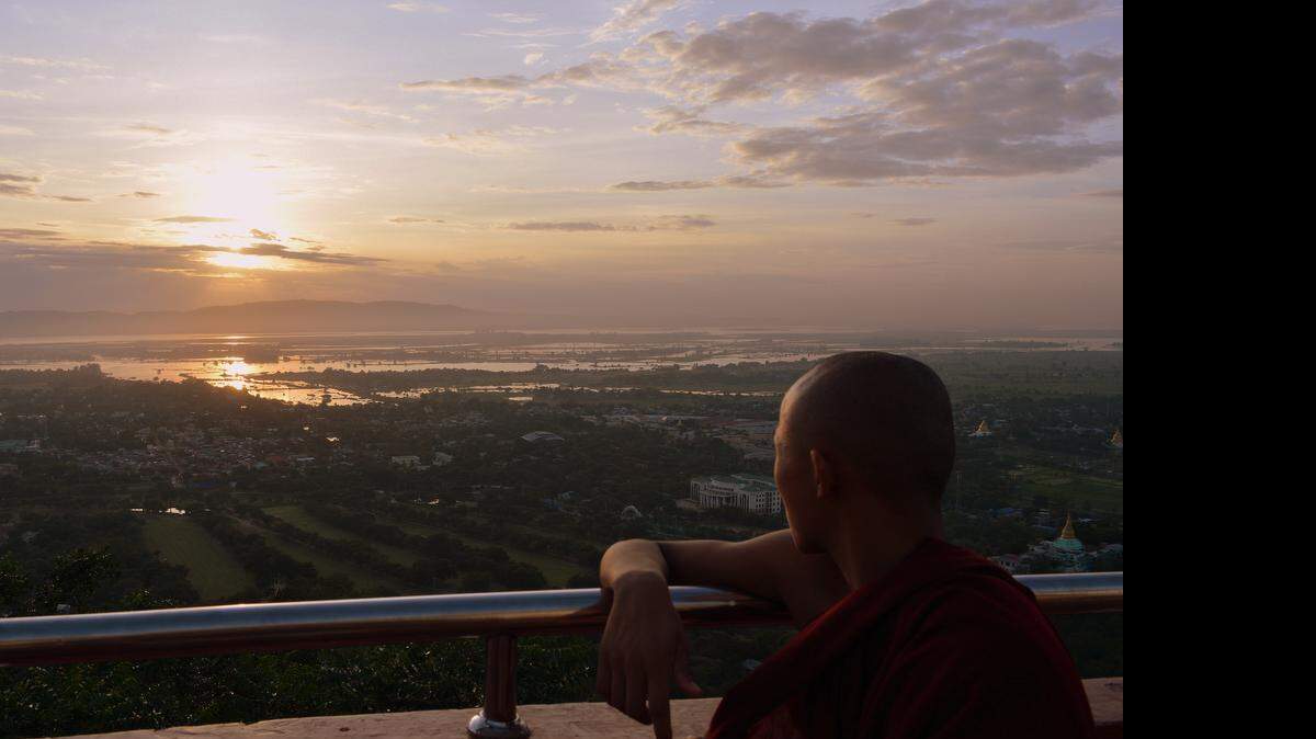 
A Buddhist monk watches the sunset in Myanmar.
