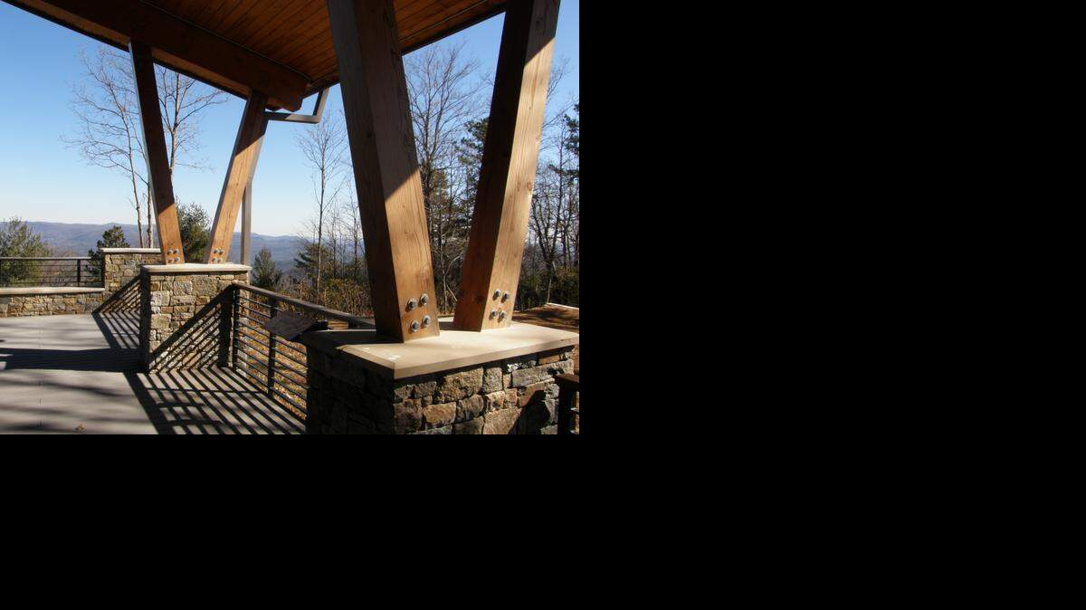 
The rear patio of the Gorges State Park visitor center invites guests to pull up a chair, relax, and enjoy the mountain scenery. 
