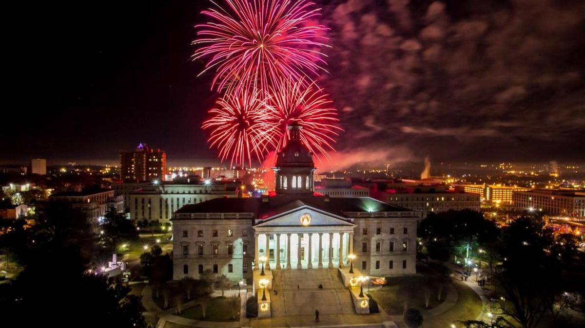 Fireworks explode above South Carolina’s State House, in Columbia, to mark the start of a new year.