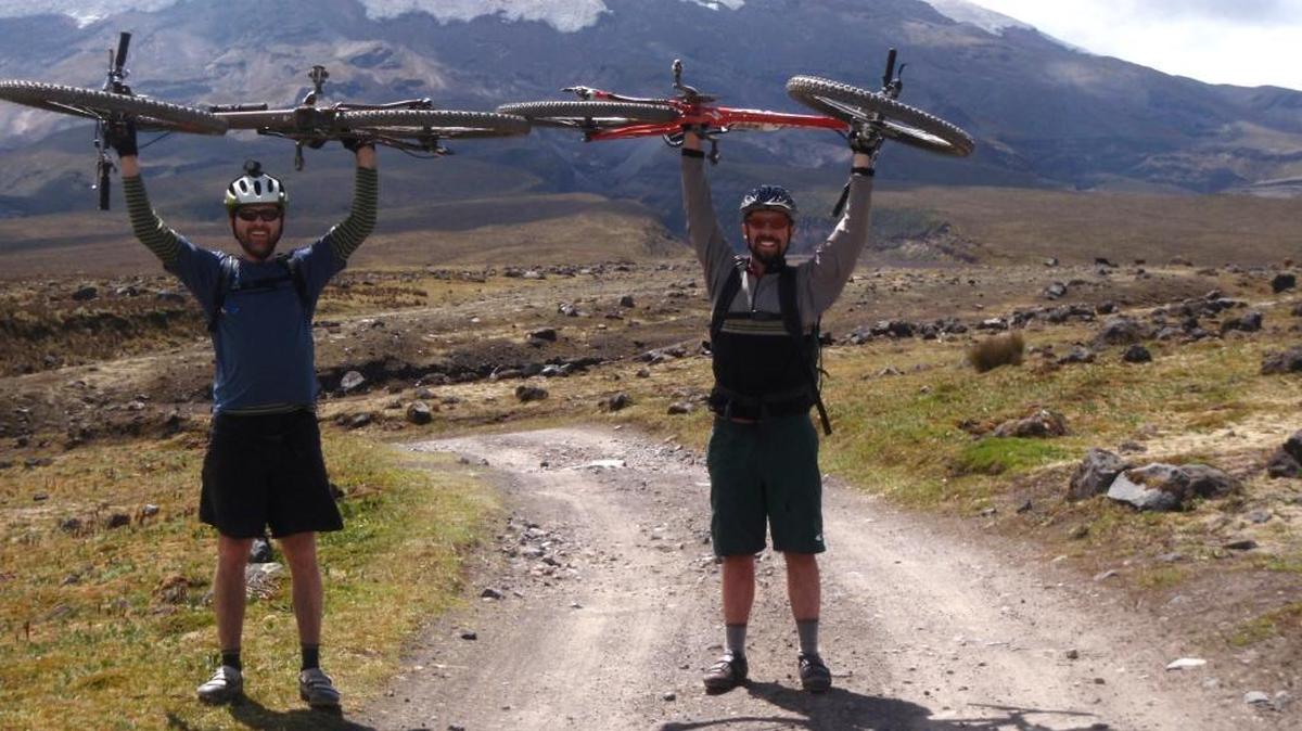 Brian Morgan, left, and friend Seth Jarsky, mountain biking at Cotopaxi, an active volcano in the Andes range in Ecuador. That’s Cotopaxi behind them.