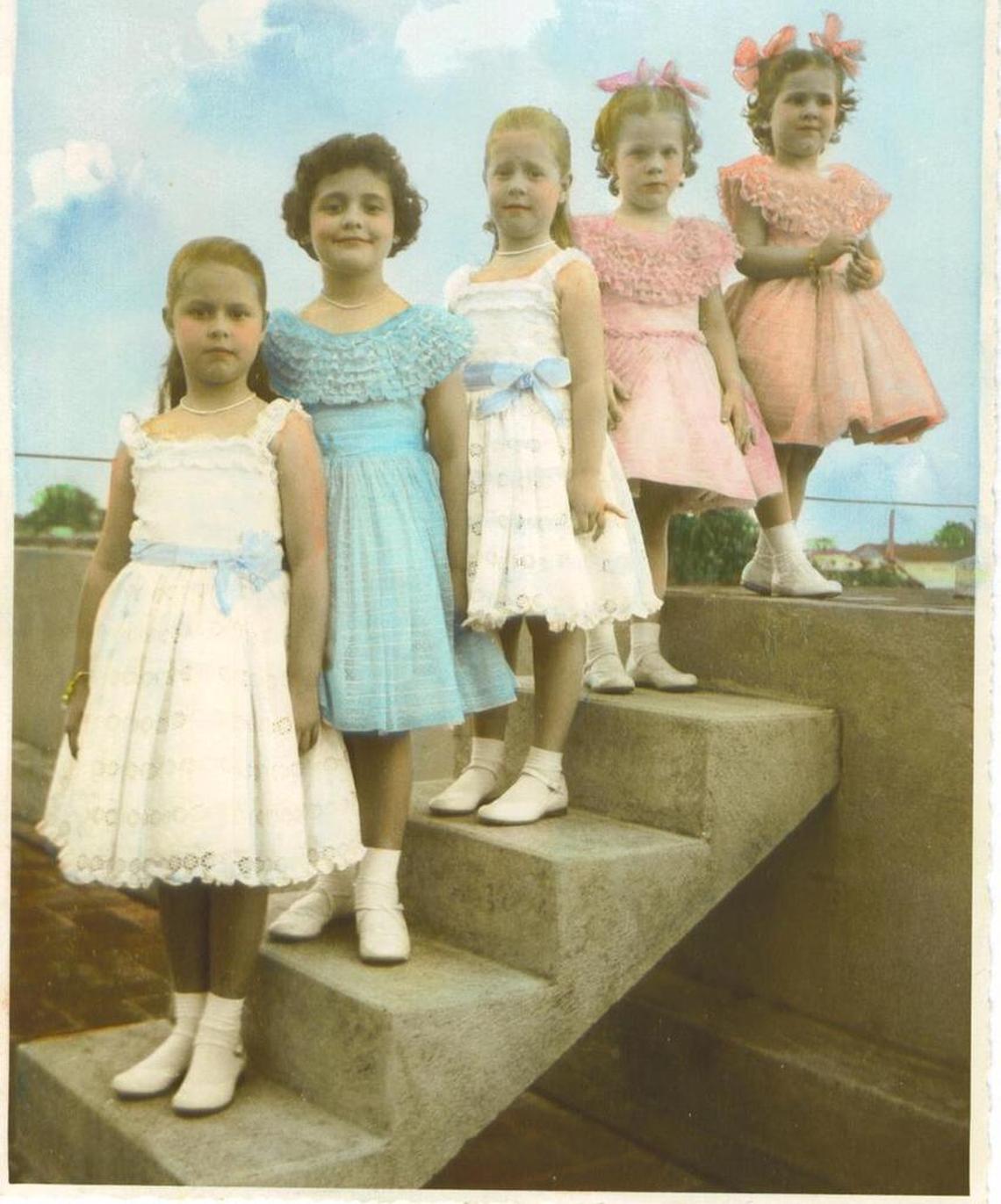 This photo, taken around 1957, shows my mother (front), my aunt (middle) and their cousins on the roof of my great-grandparents’ home in Los Arabos, Cuba. We four travelers recreated the photo during a trip in April.