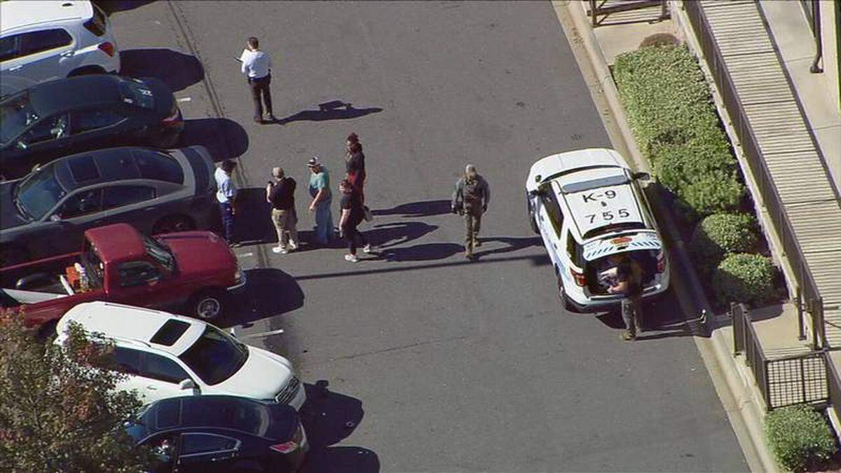 In this image from WSOC video, a Charlotte-Mecklenburg Police canine unit arrives at the scene of a shooting in southwest Charlotte on Tuesday, Oct. 4, 2022.