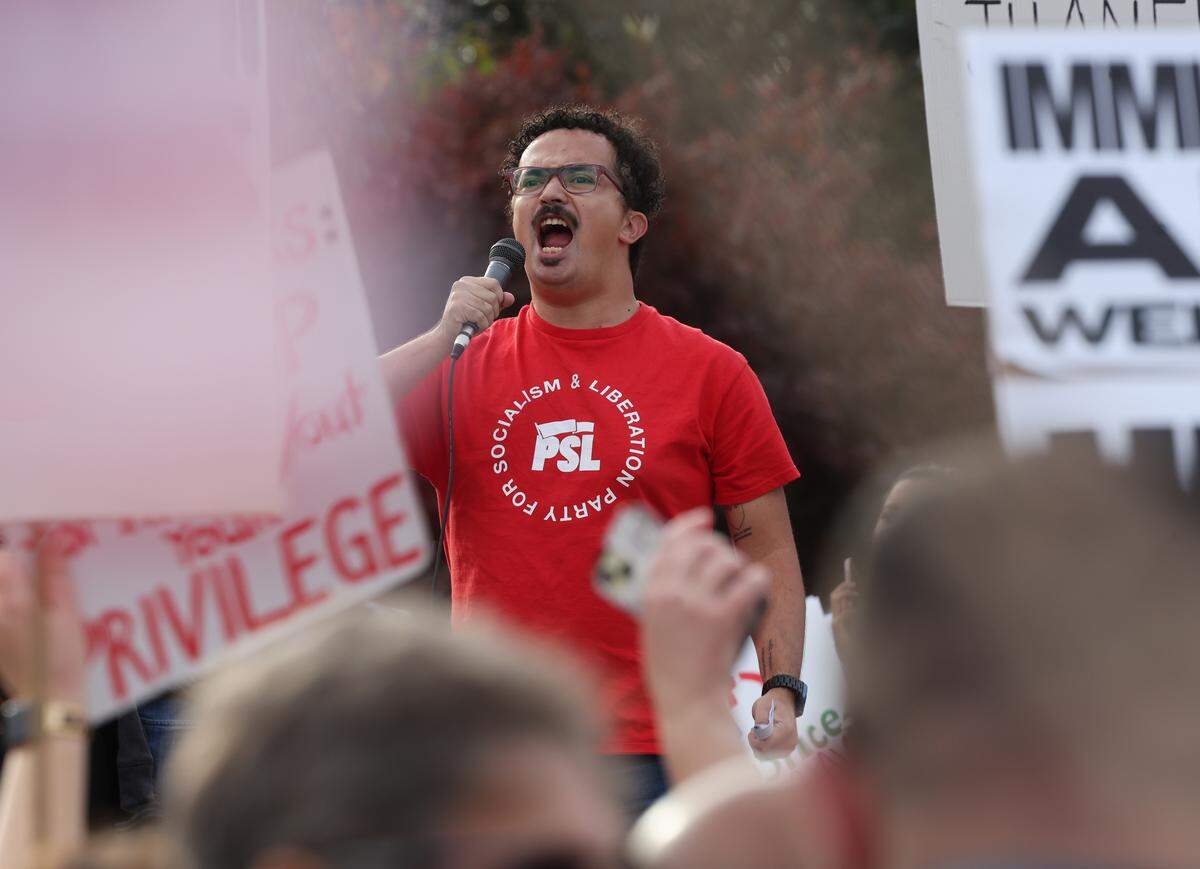 A protester chants during the No Border Patrol protest on Saturday, Nov. 15, 2025 in uptown Charlotte