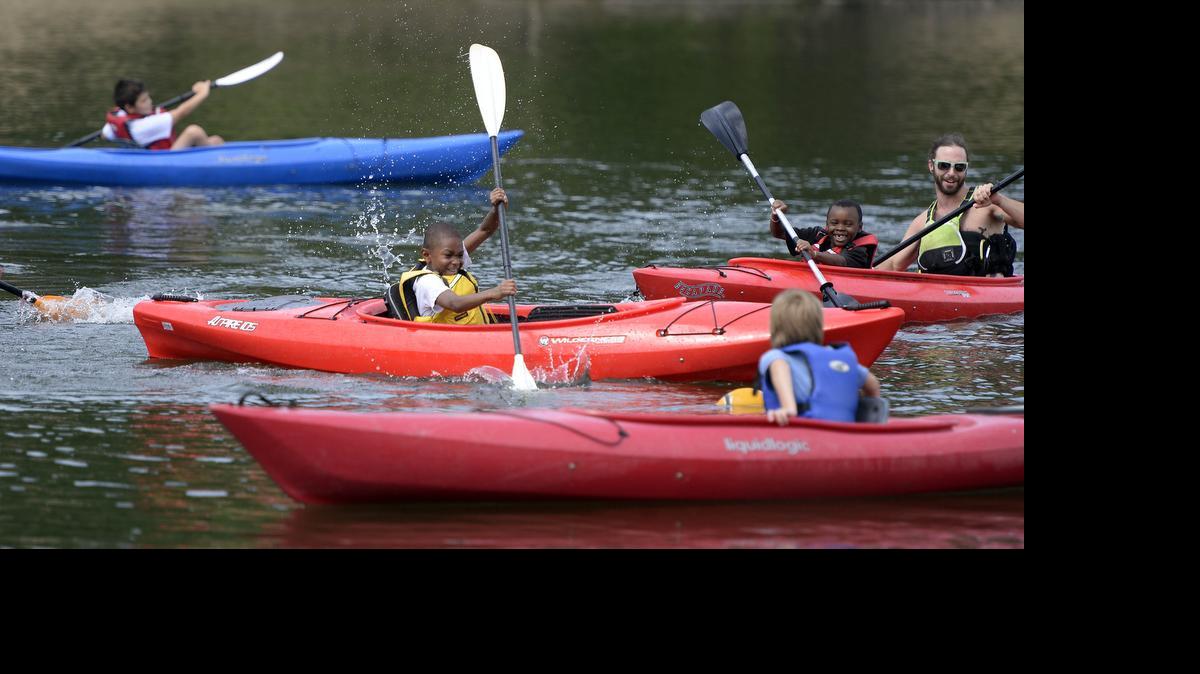 
Jamir Easter smiles as he paddles his kayak during a session with the Urban Outdoor Connection Camp at McDowell Nature Preserve in July. Jamir attends the camp through Methodist Homes Recreation Center and is a recipient of a Summer Camp Fund Scholarship. 
