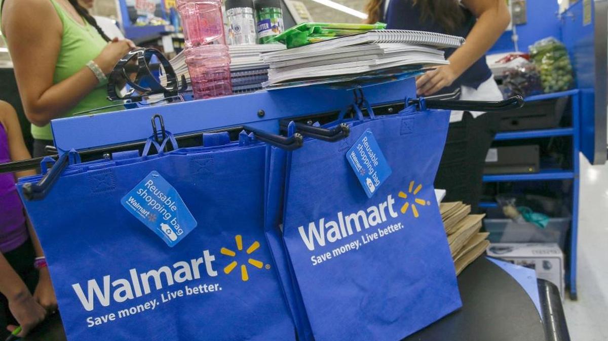 A cashier scans purchases at a Wal-Mart Stores location in the Porter Ranch neighborhood of Los Angeles in August.