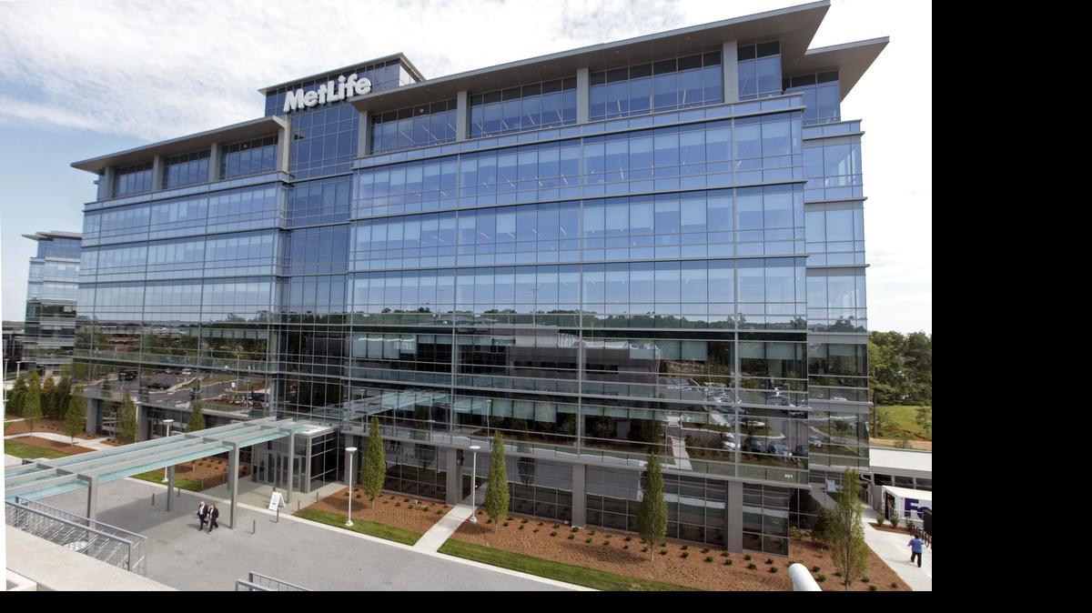 
The Met 2 building, one of two new MetLife 213,500 square foot office buildings that were officially opened Monday morning on MetLife's new Global Technology Campus in Cary. MetLife CEO Steven Kandarian noted during the grand opening ceremony that MetLife will create more than 2,600 jobs and invest $125.5 million dollars in North Carolina between its new Cary tech hub and its US retail headquarters in Charlotte, NC. The new 26.5 acre campus at 9000 Weston Parkway in Cary has already hired more than 1,000 to staff its newest tech hub.
