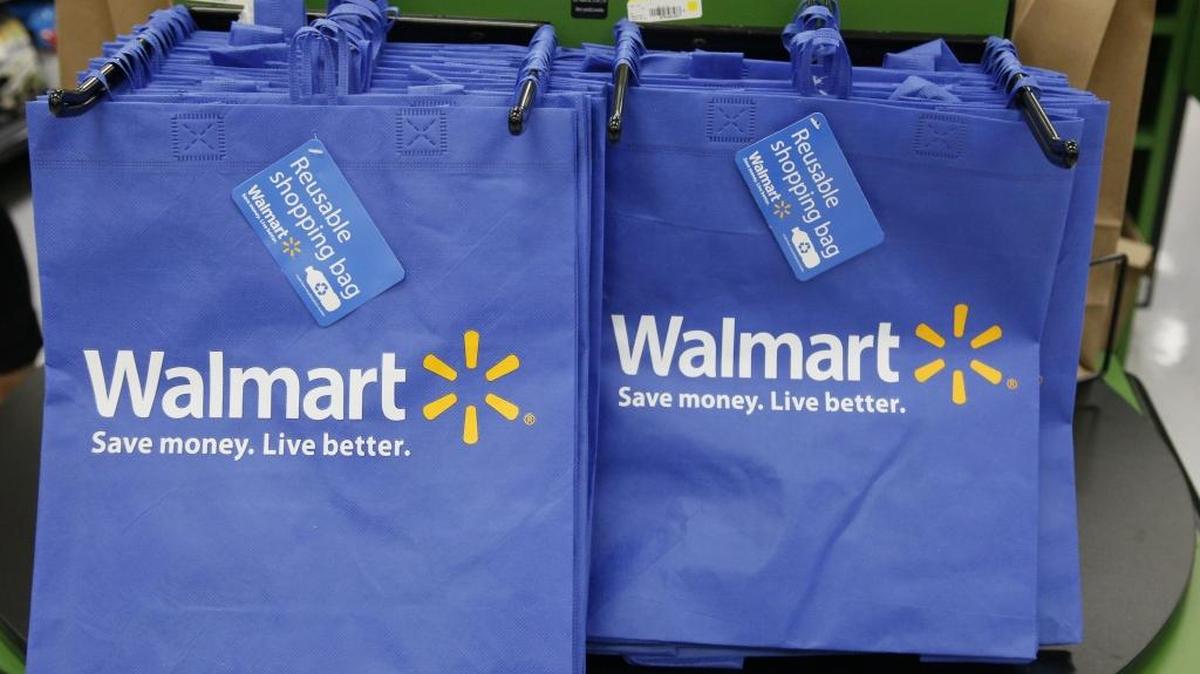 In this Thursday, Sept. 19, 2013, file photo, reusable shopping bags are offered for sale at a Wal-Mart Neighborhood Market, in the Chinatown district of Los Angeles.