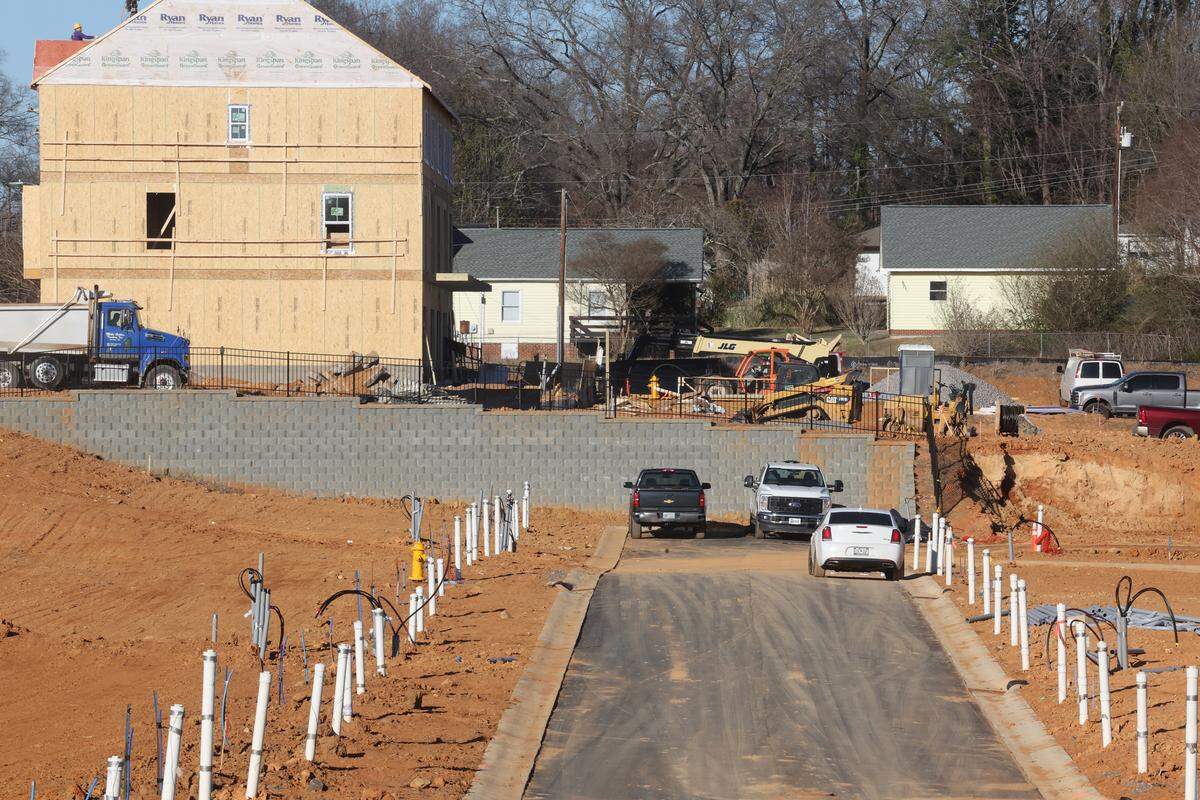 A new Redfiin study found diverging home price trends in Charlotte depending on the neighborhood. Seen here is a construction crew in north Charlotte. 