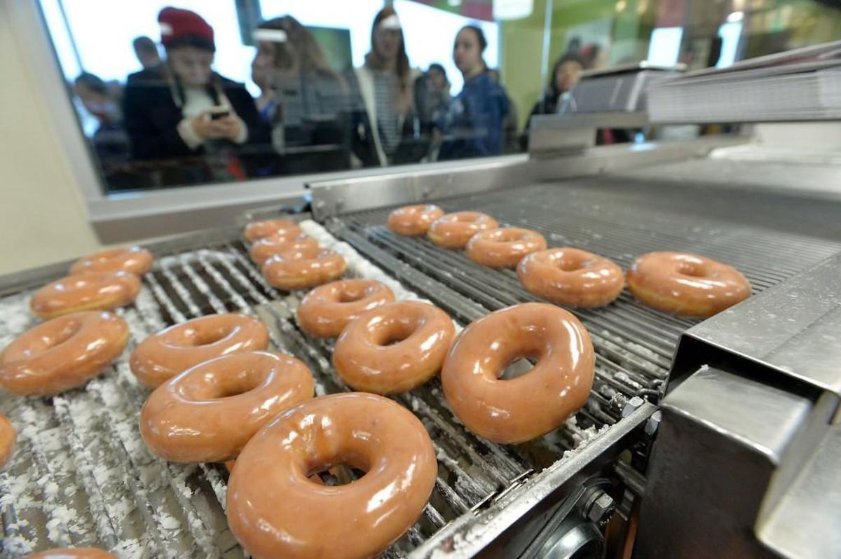 Krispy Kreme, founded in 1937, has quietly opened its new corporate office in a refurbished textile mill in South End.