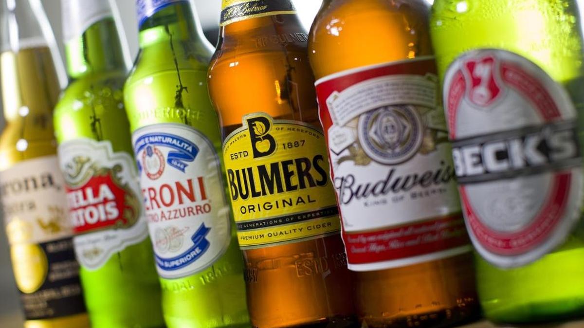 
Bottles of beer and cider produced by Belgian-Brazilian group Anheuser-Busch InBev, (Budweiser, Corona, Stella and Beck's) and British brewer SABMiller (Bulmers and Peroni) are pictured in London, on October 13, 2015. 
