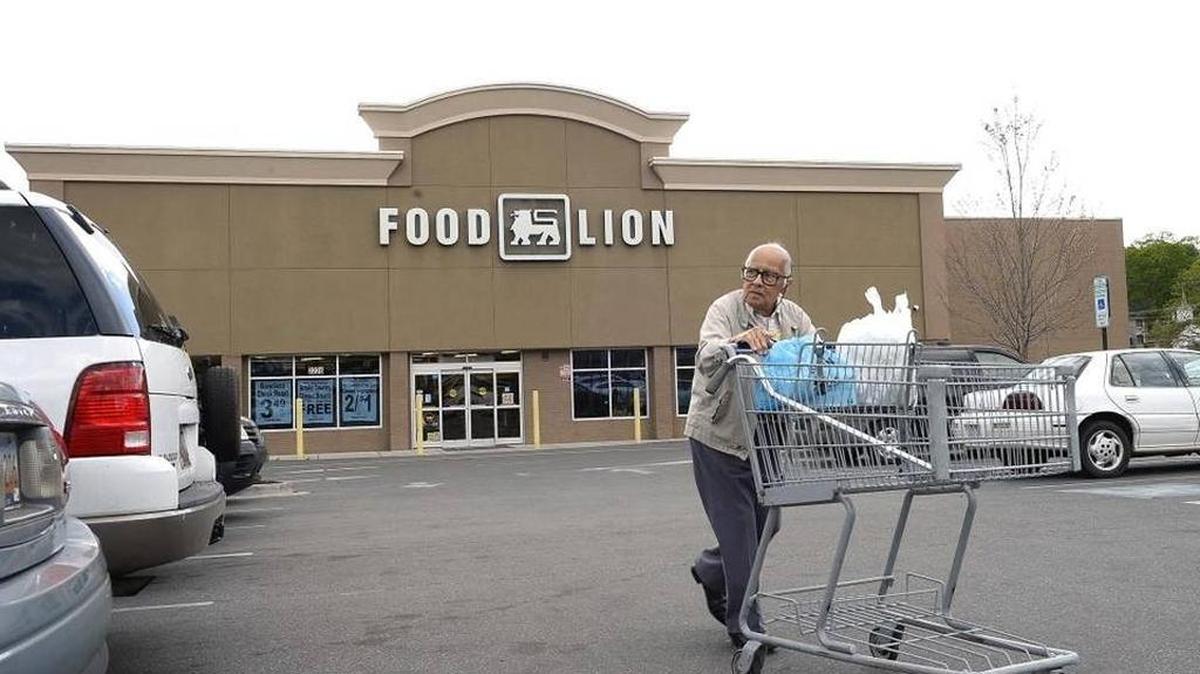 Louis Villanueva of Charlotte heads to his car after shopping at the Park Road Food Lion in Dilworth on April 7, 2016.