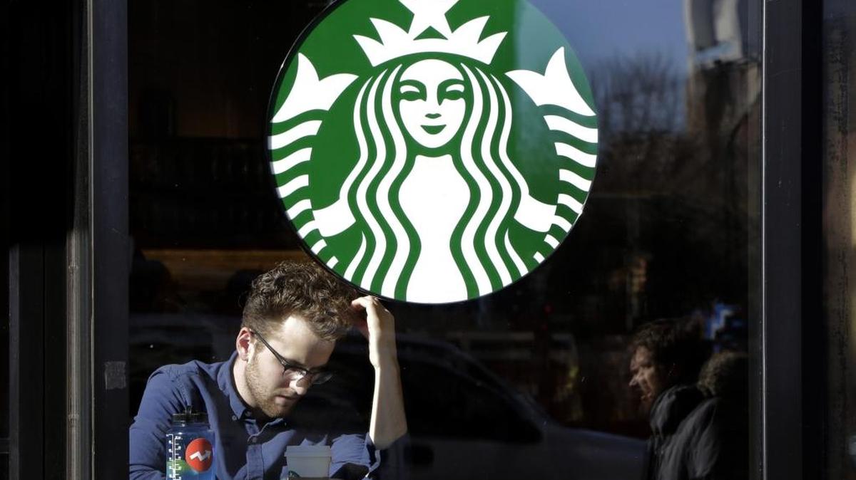 In this Jan. 11, 2016, photo, a man sits inside a Starbucks, in New York.