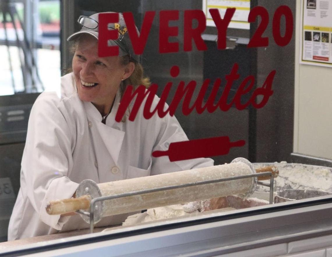 Bojangles’ employee Anita Block shares a laugh with a co-worker while making a new batch of biscuits at a renovated Bojangles in Charlotte in this 2016 file photo.