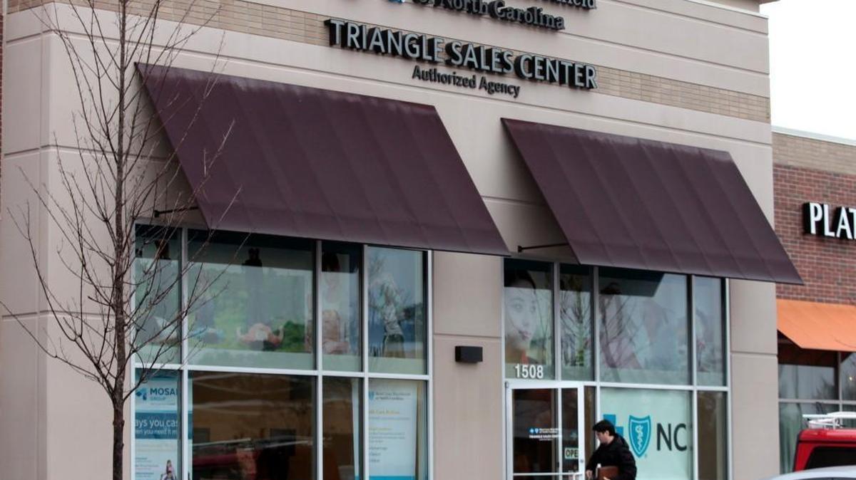 A client enters the Blue Cross Blue Shield of North Carolina Triangle Sales Center in the Village Market Place shopping center in Morrisville. The N.C. Department of Insurance says it has now received more than 8,700 calls and about 1,900 formal complaints against Blue Cross this year.