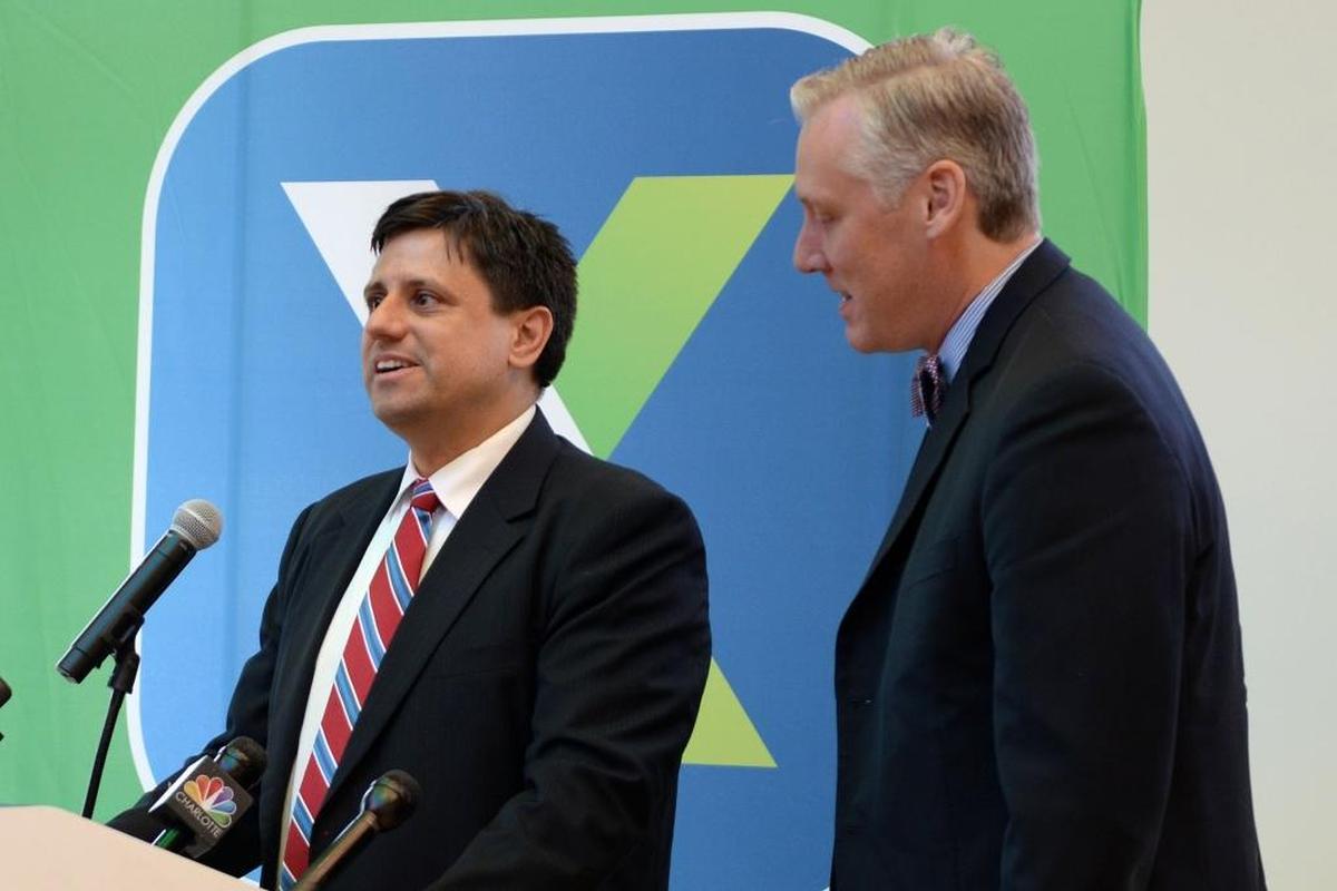 Michael Praeger, CEO of AvidXchange, introduces Richard Crum, the SVP of New Product Development at MasterCard, at a press conference to announce their partnership to make payments easier for small businesses in their new location on Thursday, June 8.