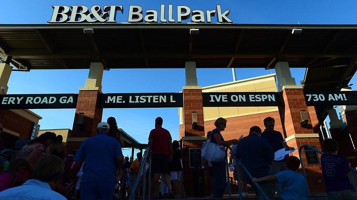 Fans make their way into BB&T BallPark in uptown Charlotte Saturday, July 5, 2014.