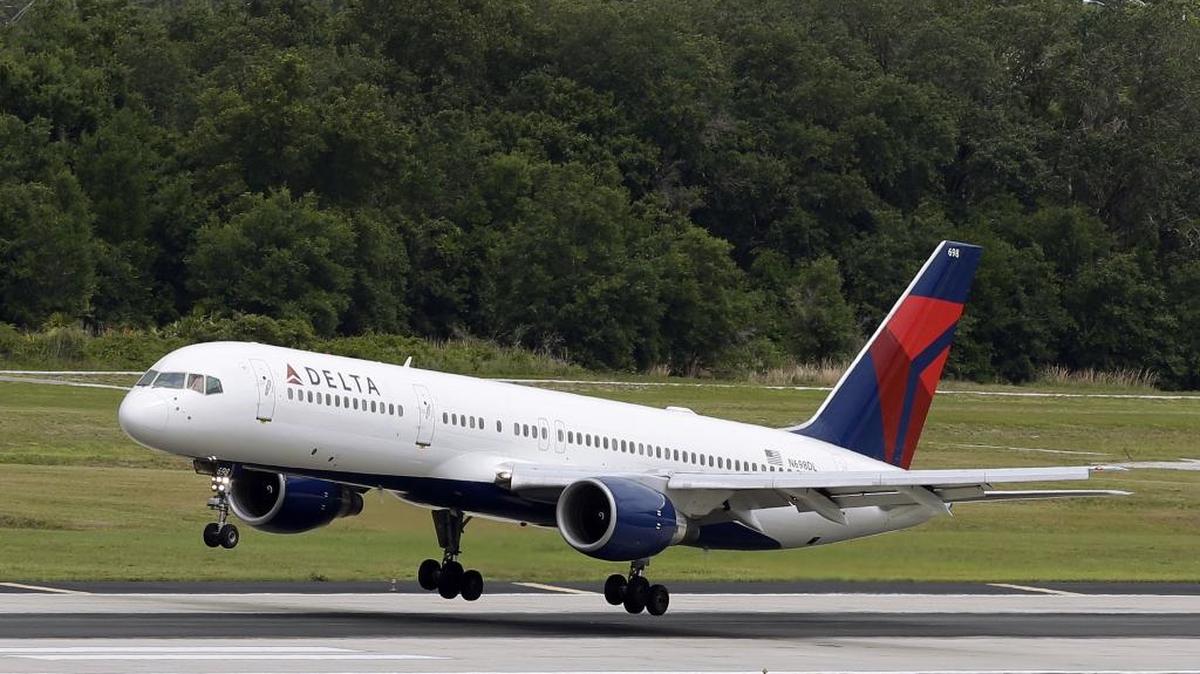 FILE - In this Thursday, May 15, 2014, file photo, a Delta Air Lines Boeing 757-232 lands at the Tampa International Airport in Tampa, Fla.