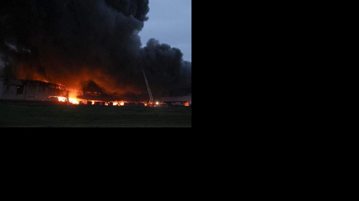 
Firefighters battle a flames at General Electric’s Appliance Park in Louisville, Ky., Friday, April 3, 2015. The fire broke out in a non-production building, creating huge columns of smoke as more than 100 firefighters battle the blaze. GE spokeswoman Kim Freeman says there are no known injuries. 
