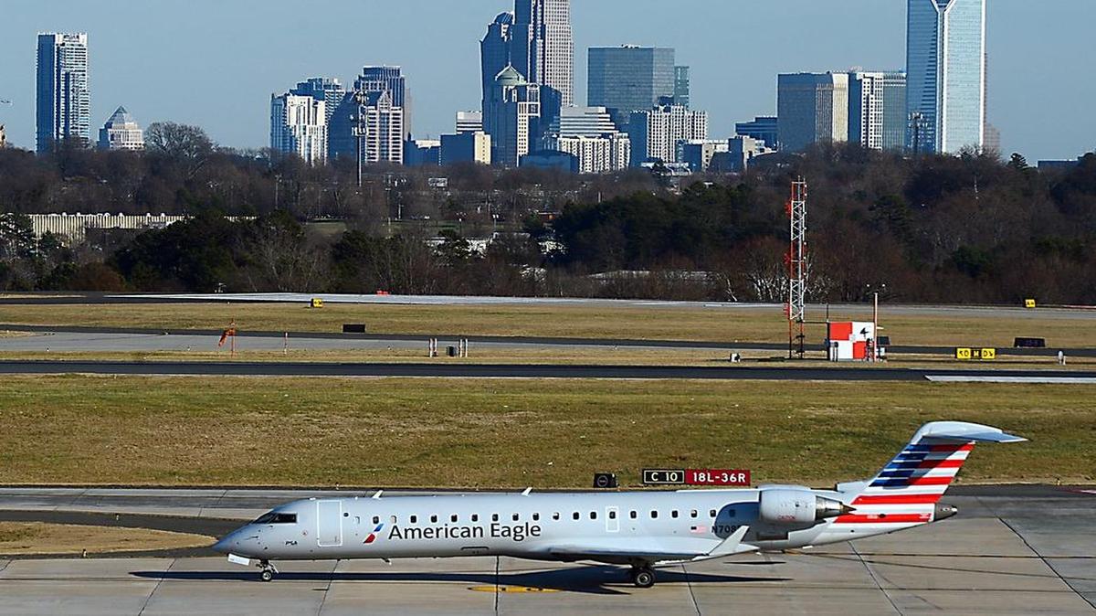 
An American Eagle jet taxis to the terminal at Charlotte Douglas International Airport on Dec. 17, 2014. 
