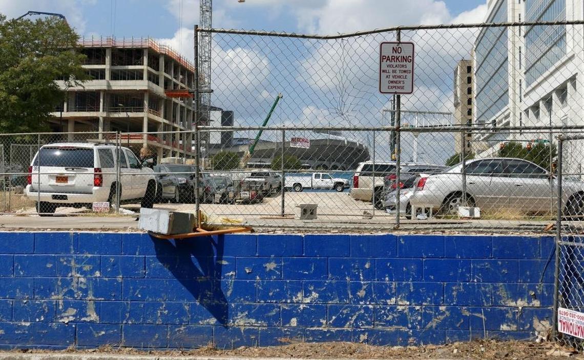 Cars parked at the old Goodyear store site at the corner of West Stonewall Street and South Tryon Streets. Crescent Communities has announced that Ally Financial will occupy more than half of a 26-story, 742,000 square-foot office tower to be built at the site.