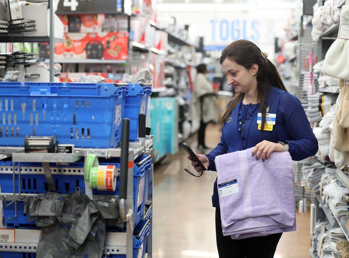 Meral Kemaloglu shops for online orders Thursday at the Indian Trail Walmart.