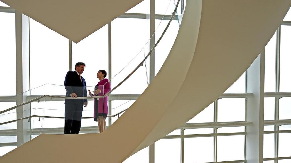 Piedmont Natural Gas chairman and CEO Thomas Skains, left, and Duke Energy CEO Lynn Good, right.